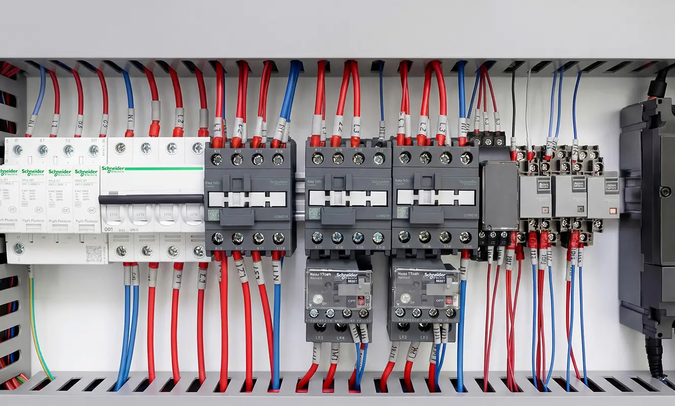 CNC router electrical components The Spire Series uses Schneider electrical components and a Delta variable frequency drive to provide the required control and protection for the machine's electrical and spindle systems.
