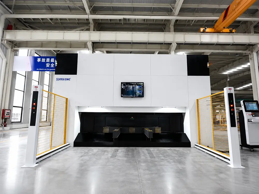 Front view of the 3D 5-axis fiber laser cutting machine with rotary exchange worktable Front view of the 3D 5-axis fiber laser cutting machine with rotary exchange worktable