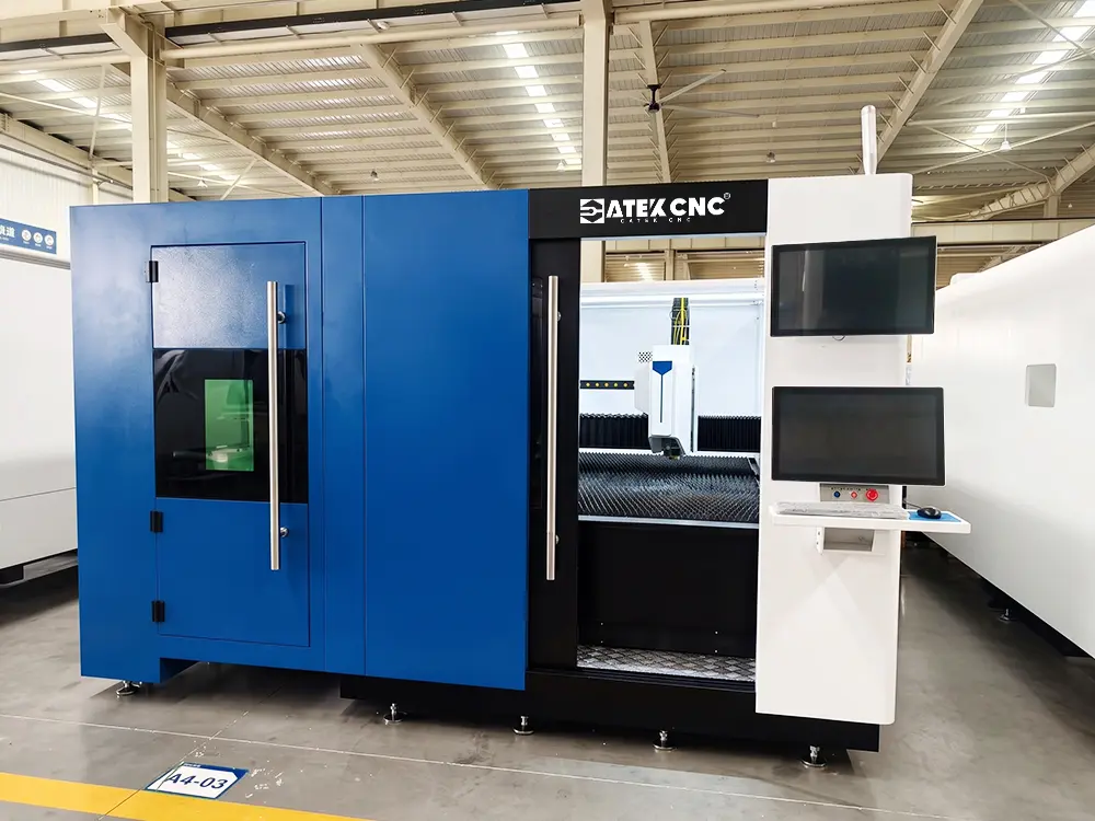Front view of the fiber laser sheet and tube cutting machine with shuttle table Front view of the enclosed fiber laser sheet and tube cutting machine with shuttle table