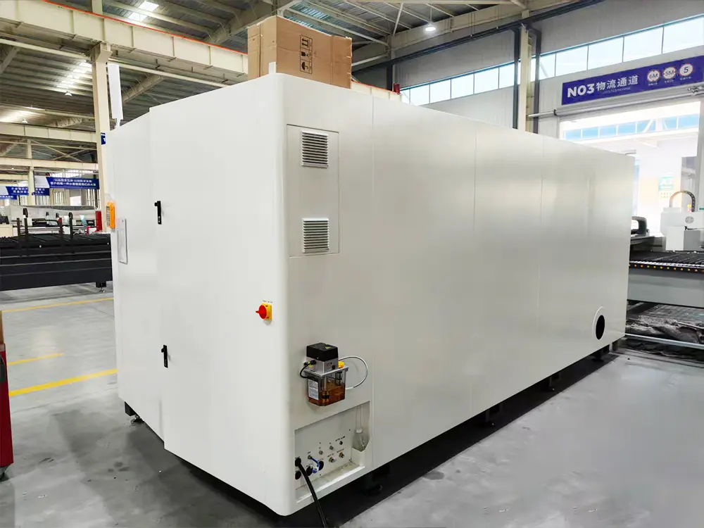 Rear left view of the enclosed fiber laser sheet cutting machine with pull-out worktable Rear left view of the enclosed fiber laser sheet cutting machine with pull-out worktable