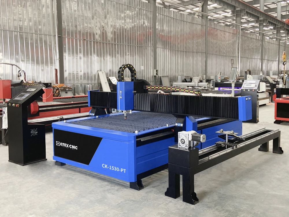 Front left view of 5x10 CNC plasma cutting machine with rotary 4th axis Front left view of 5x10 CNC plasma cutting machine with rotary 4th axis