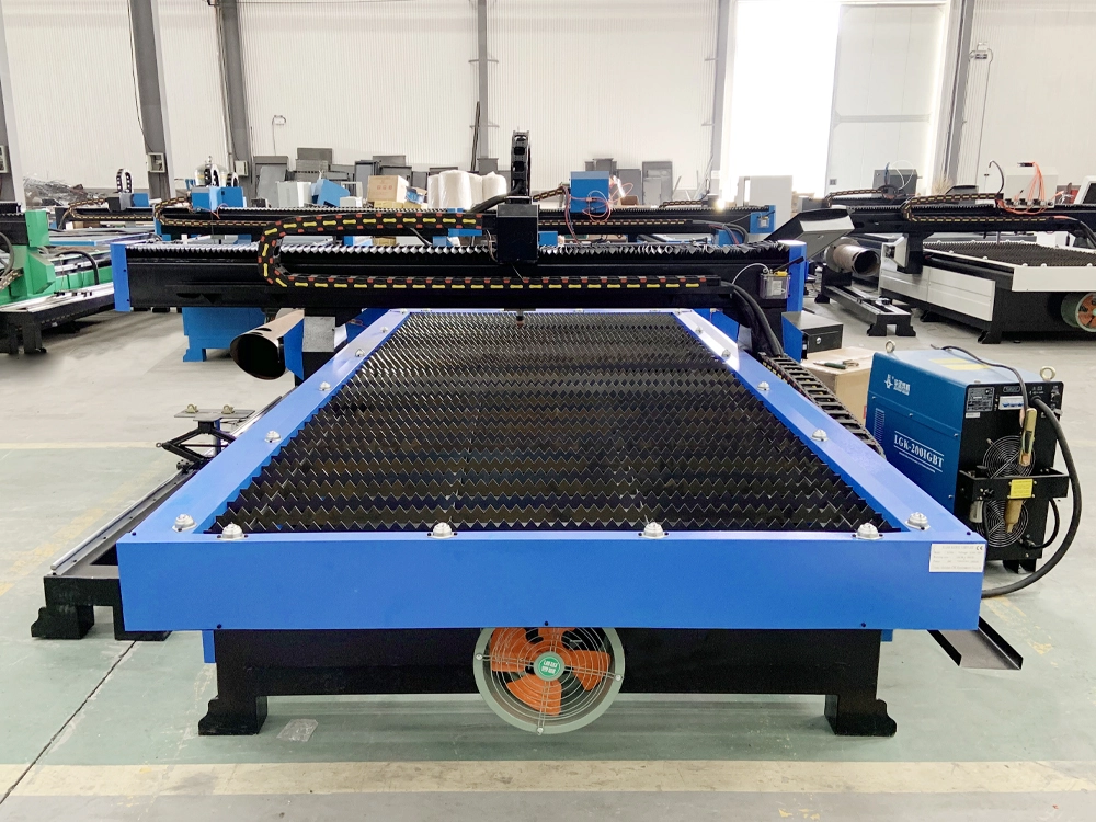 Rear view of 5x10 CNC plasma cutting machine with rotary 4th axis Rear view of 5x10 CNC plasma cutting machine with rotary 4th axis