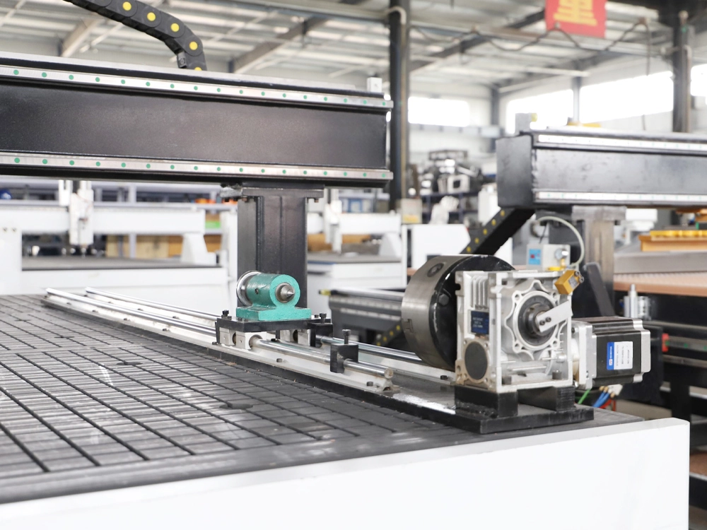 Optional workpiece clamping rotary axis for 7'x10' four-axis linear ATC CNC router Optional workpiece clamping rotary axis for 7'x10' four-axis linear ATC CNC router