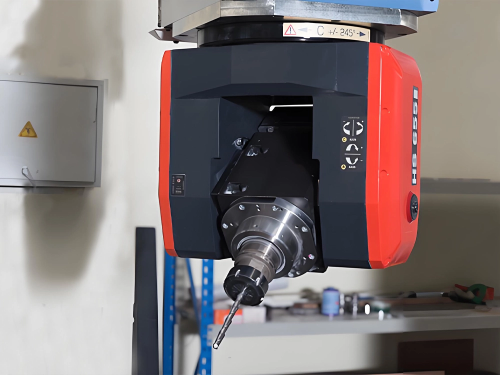 Automatic tool change spindle on the five axis machine head